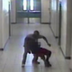 Surveillance footage shows school security guard Robert Fields dragging a student to the ground by his neck at Arlington High School in Virginia.
WJAX-TV screenshot